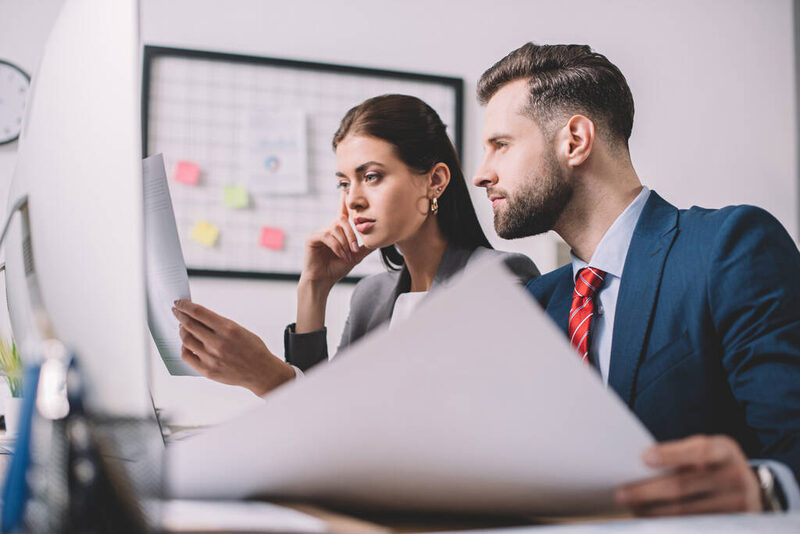 Technology consultants analyzing systems